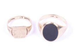 Two gold signet rings.