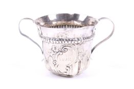 A George III silver porringer.