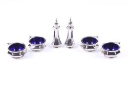 An Edwardian silver six piece cruet set.