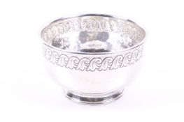 Liberty & Co Ltd, a planished-silver round bowl on foot.