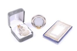 A small collection of silver including a modern silver 'tooth fairy' thimble shaped box.