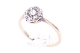 An early 20th century gold and diamond small cluster ring.