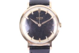 Majex, a gentleman's 9ct gold cased wrist watch, circa 1958.