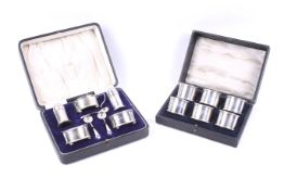 A set of silver napkin rings and a cruet set.