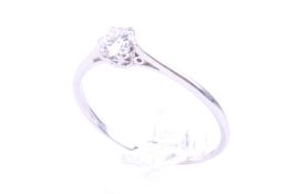 A mid-20th century gold and diamond solitaire ring. The round brilliant approx. 0.