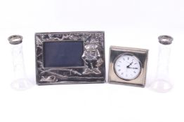 A group of silver mounted items including a silver 'fishing' photograph frame.