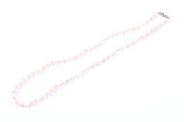 A Mikimoto cultured-pearl single row necklace. The 63 round beads slightly graduated beads approx.