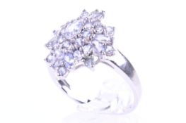 A modern 9ct white gold and tanzanite oval cluster ring.