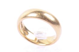 An early 20th century 22ct gold wedding band.