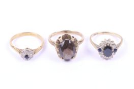 Three gold and gem set dress rings. Comprising; a 9ct gold and sapphire cluster ring, size K, 2.