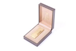 Dunhill, a Swiss made gold-plated rectangular pocket lighter, reference ML 3838.