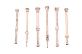 A group of six Victorian and later gilt metal propelling pencils.
