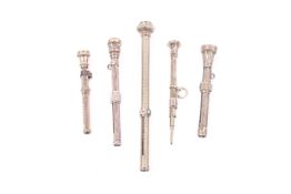 Two Victorian gold and three gold-plated propelling pencils.