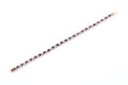 A vintage sapphire and diamond line bracelet.