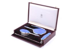 Asprey, a vintage silver and blue guilloche enamelled four piece dressing table set.