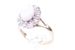A vintage 18ct gold, opal and diamond oval cluster ring.
