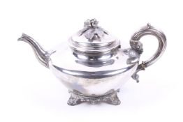 A William IV silver compressed round tea pot.