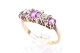 A late Victorian gold, ruby and diamond five stone ring with rose diamond points.