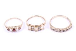 Three vintage 9ct gold and gem set dress rings.