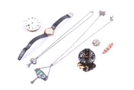 A small collection of jewellery including a citrine oval brooch.