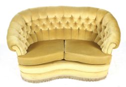 A Victorian kidney-shaped settee or sofa.