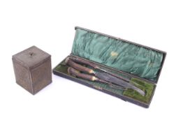 A Rowntree chocolate biscuit tin and a Victorian carving set.