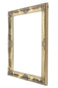 An antique style gilt framed wall mirror.