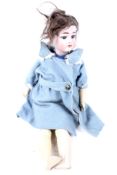 An antique German Limbach bisque head doll.
