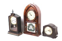 An American mantel clock and two other mantel clocks.