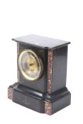 A Victorian mantel clock.