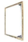 A 20th century large bevelled edge wall mirror.