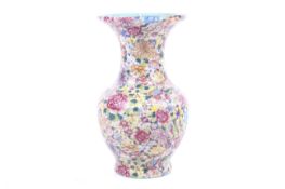 A Chinese millefleur vase. With everted rim over a bulbous body, glazed turquoise to the inside.