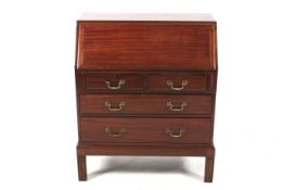 A Liss Bros. Ltd stained mahogany bureau.