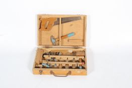 A childrens tool kit within a wooden box.