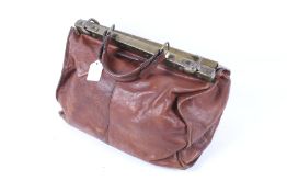 A vintage Pielle brown leather Gladstone style doctor's bag.