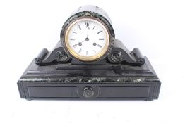 A Victorian black slate 'drum' mantel clock.