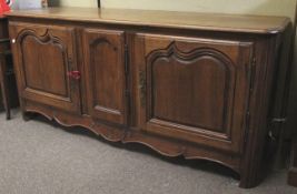 A 20th century oak sideboard.