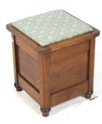 A Victorian mahogany stool with storage beneath seat.