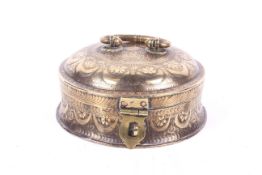 A Middle Eastern brass spice box.
