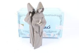 A Lladro figure 'Monks at Prayer'.