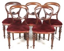 A set of five Victorian mahogany balloon back chairs.