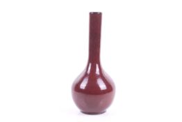 A 20th century Chinese sang-de-boef glazed bottle vase. H31.5cm.