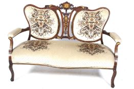 An Edwardian inlaid mahogany parlour sofa.