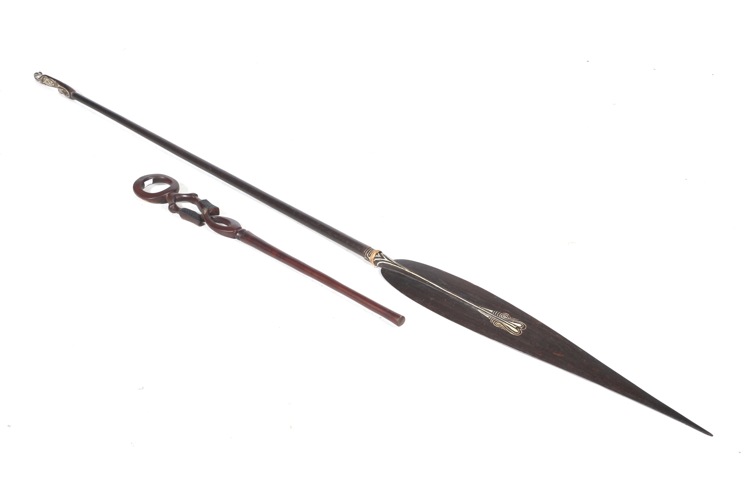 Papua New Guinea. A long spear and a ceremonial staff.