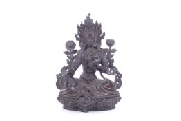 A Tibetan bronze figure of a Green Tara.