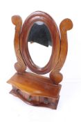 A hardwood dressing table mirror.