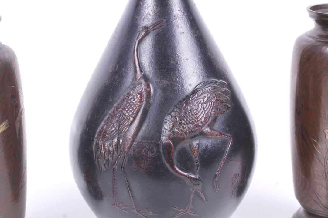 A pair of small bronze Japanese Meiji period vases and a further vase with cranes. - Image 3 of 3