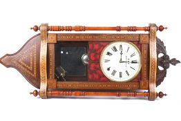 A late 19th century marquetry walnut veneered wall clock.