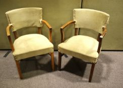 A pair of vintage oak framed armchairs.
