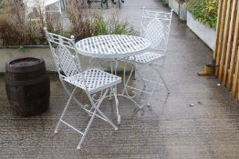 A metal garden table and chairs set.